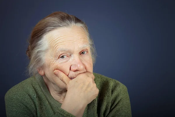 Portrait of elderly woman. Thoughtfulness. Toned — Stock Photo, Image