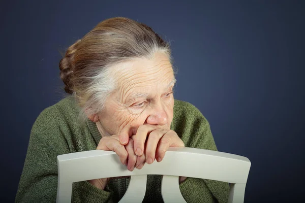 Portrait of elderly woman. Thoughtfulness. Toned — Stock Photo, Image