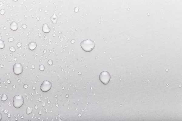 Druppels water op een gekleurde achtergrond. Gray — Stockfoto