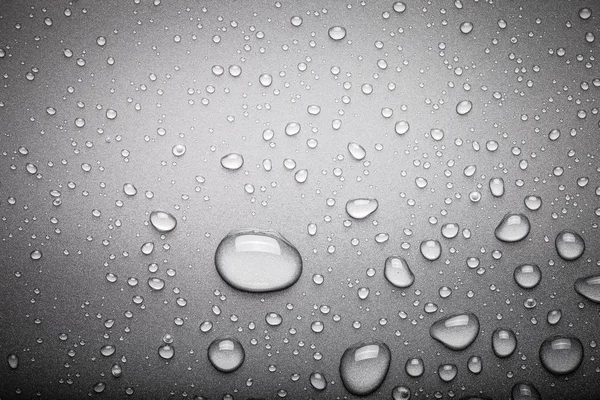 Drops of water on a color background. Dark grey. Toned — Stock Photo, Image