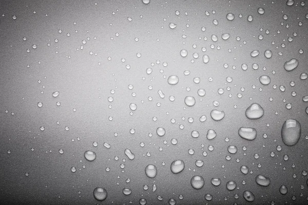 Drops of water on a color background. Dark grey. Toned — Stock Photo, Image