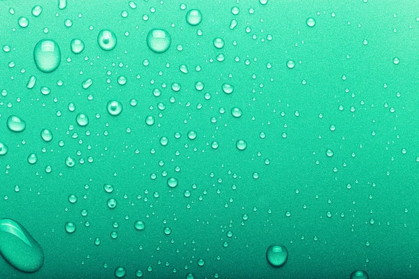 Kapky vody na barevném pozadí. Selektivní zaměření. Zelené. K — Stock fotografie