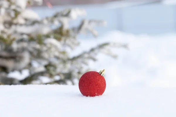 Cristmas tree branches and bright balls on a clean pure snow for — Stock Photo, Image