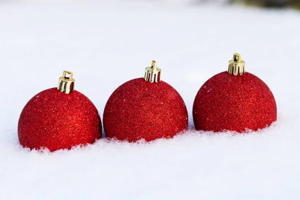 Bright balls on a clean pure snow for natural winter background. — Stock Photo, Image
