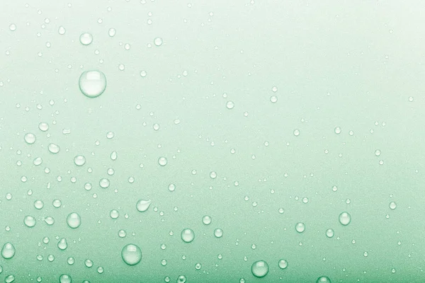 Drops of water on a color background. Selective focus. Green. To — Stock Photo, Image