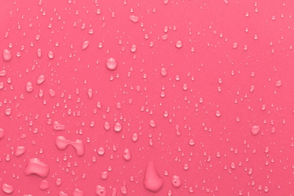 Gocce d'acqua su uno sfondo a colori — Foto Stock