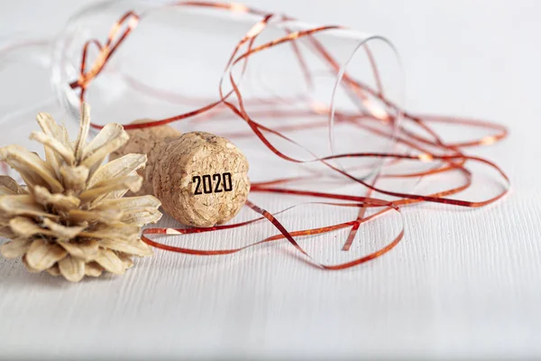 New year composition with champagne cork on a light background — Stock Photo, Image