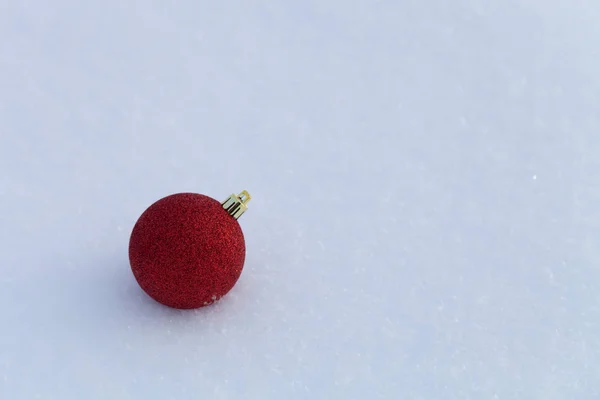 Bright balls on a clean pure snow for natural winter background. — Stock Photo, Image