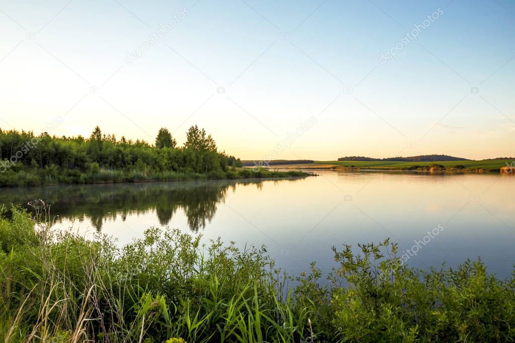 Summer sunny landscape. Morning, dawn on the lake. Saratov Region, Russia.