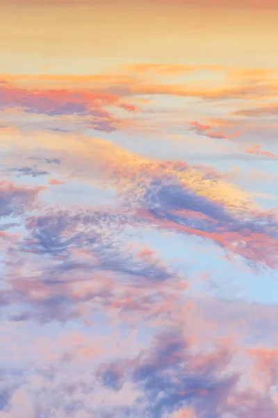 Heavenly abstract summer gentle vertical background. Beautiful picturesque bright majestic dramatic evening morning sky at sunset or dawn in orange and blue in pastel colors. The sun rises on a warm day — Stock Photo, Image