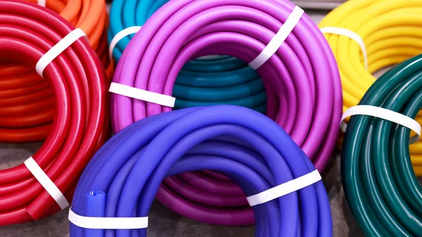 Lots New Multicolored Coils Polymer Hoses Watering Garden Goods Tools — Stock Photo, Image