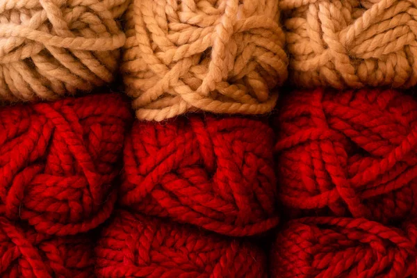 Knitting needles, red and beige colors. — Stock Photo, Image
