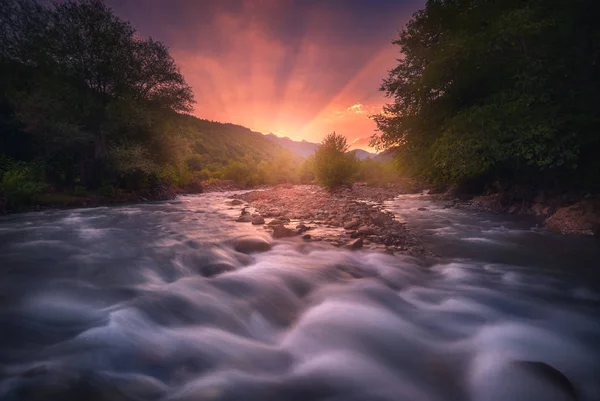 Magic sunrise over fast flowing mountain river — Stock Photo, Image