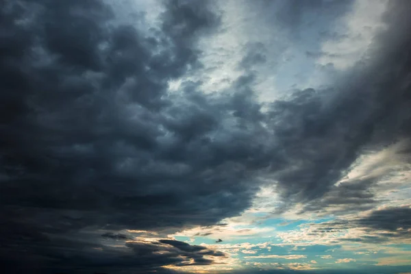 Dark, dramatic clouds, time before a storm, thundery fluffy clouds. Thunderstorm in the city.