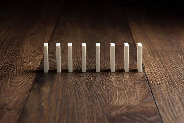 Creative Background White Domino Brown Wooden Background Concept Domino Effect — Stock Photo, Image
