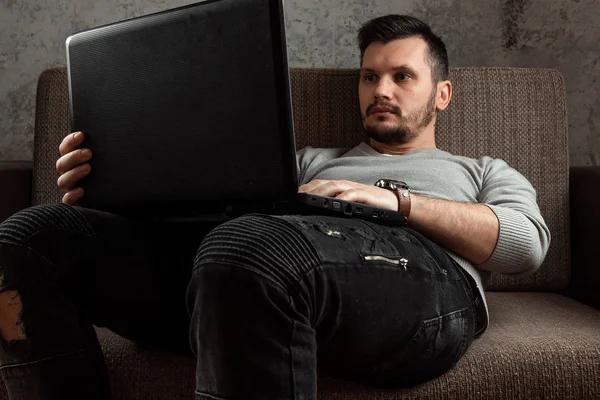 Young Man Working Laptop Relaxing Comfortable Couch Home Jeans Concept — Stock Photo, Image