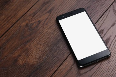 Yaratıcı arka plan, ahşap masa mockup arka plan üzerinde beyaz ekran ile akıllı telefon. Tasarım, mobil uygulamalar, Mobil Oyunlar, teknoloji için hazırlık kavramı.
