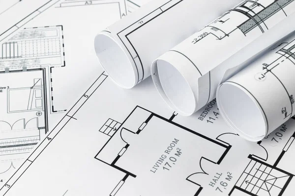 Architectural construction drawings twisted into a roll, construction projects on paper. The concept of architecture, construction, engineering. Copy space. — Stock Photo, Image