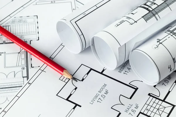 Architectural construction drawings twisted into a roll, construction projects on paper. The concept of architecture, construction, engineering. Copy space. — Stock Photo, Image