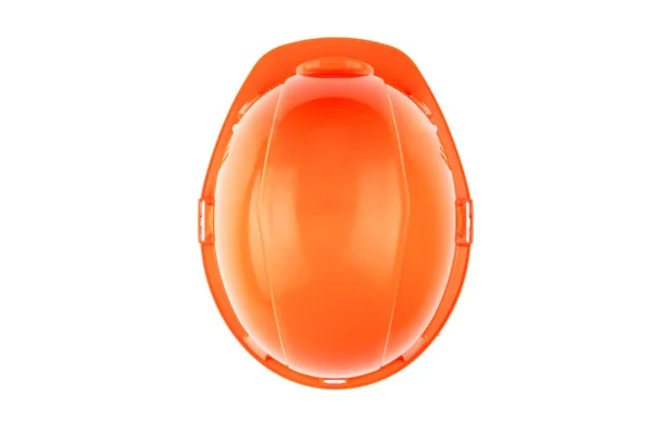 Casco de construcción naranja sobre fondo claro. El concepto de arquitectura, construcción, ingeniería, diseño. Copiar espacio. Vista superior —  Fotos de Stock