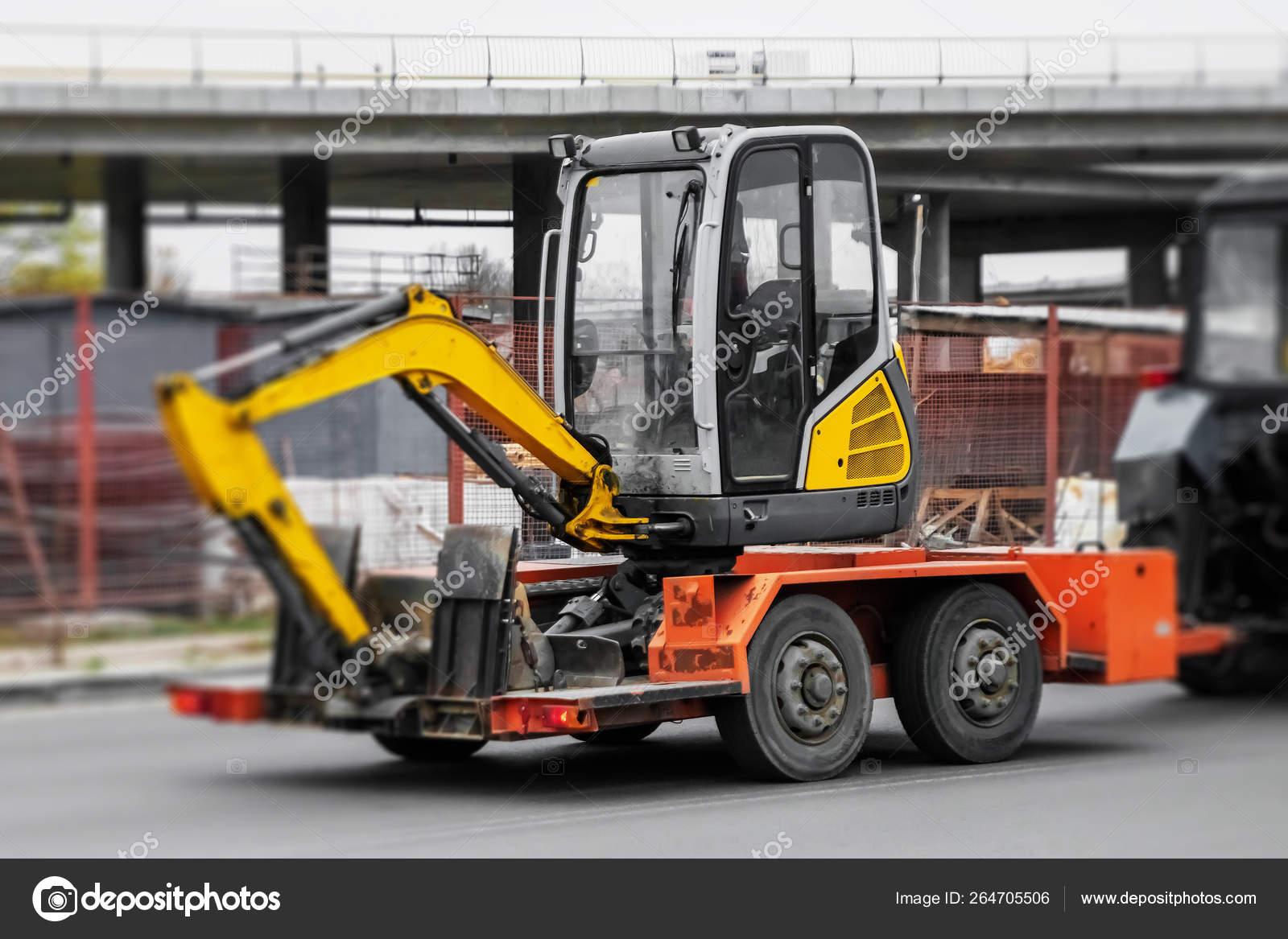 Transportation of construction equipment, a small excavator on a