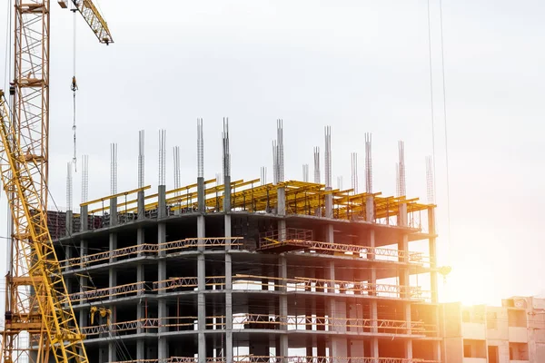 Building construction on monolithic technology. Construction of the building. Concrete frame of the building.