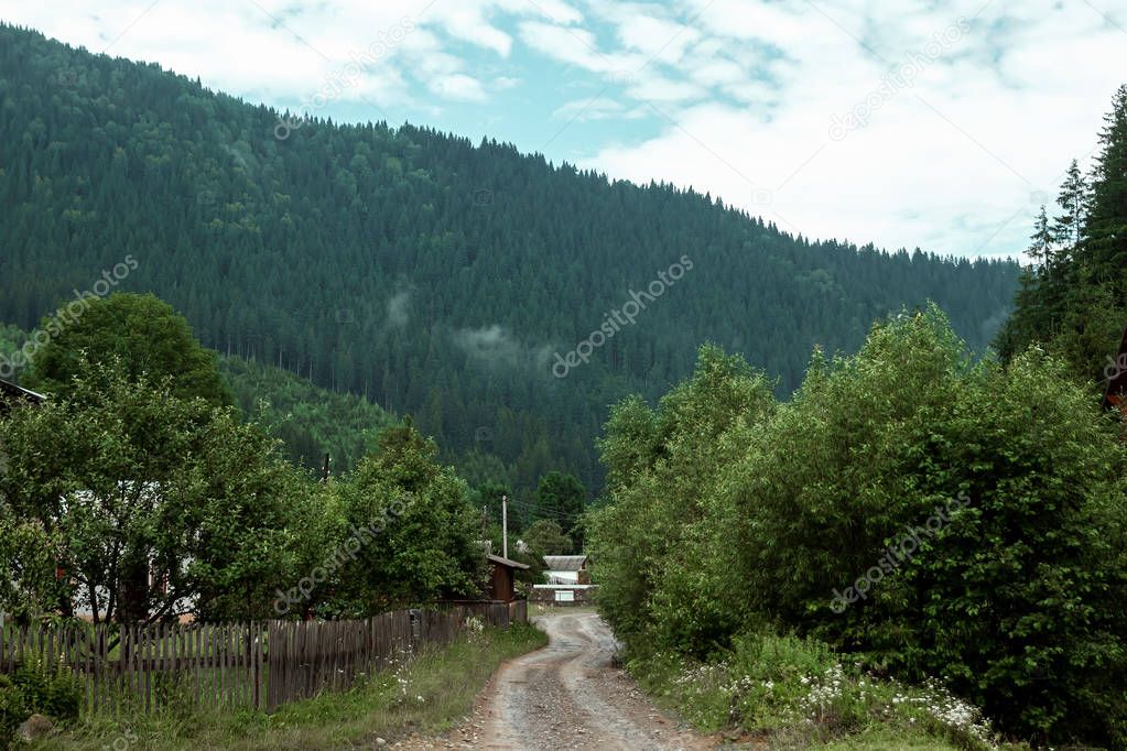 Mountain, beautiful summer landscape, road in the mountains, sky, summer. Ukraine, the Carpathian Mountains. Concept of travel, tourism, holidays, vacation