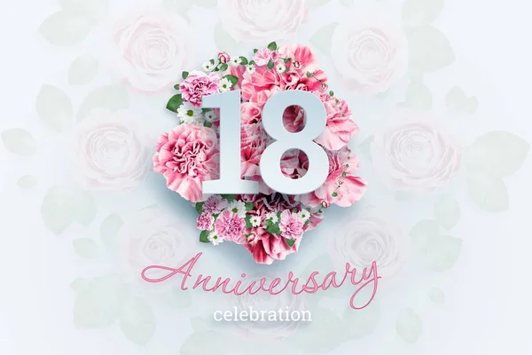 Creative background lettering 18 numbers and anniversary celebration text on pink flowers background. Anniversary concept, adulthood, birthday, celebration event, template, flyer