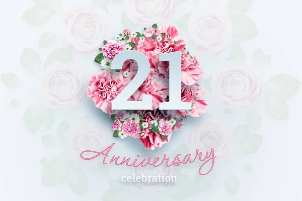 Creative background lettering 21 numbers and anniversary celebration text on pink flowers background. Anniversary concept, adulthood, birthday, celebration event, template, flyer