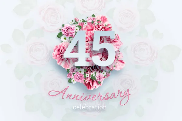 Creative background lettering 45 numbers and anniversary celebration text on pink flowers background. Anniversary concept, birthday, celebration event, template, flyer