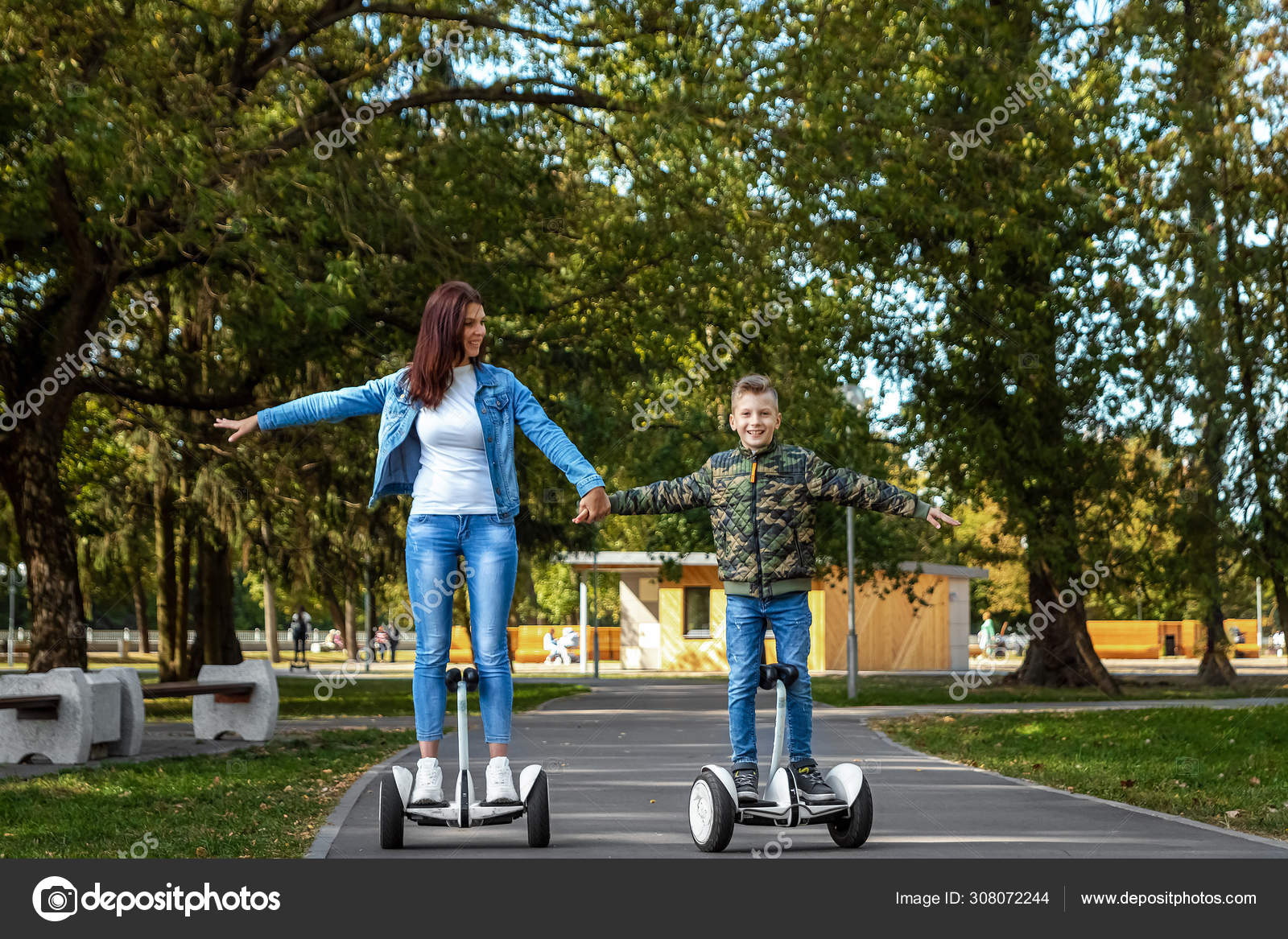 Indefinido Hundimiento programa Mom and son ride a hoverboard in the park, a self-balancing scooter. Active  lifestyle time with baby technology future Stock Photo by ©MarkoAliaksandr  308072244