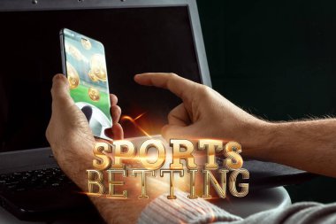 Smartphone in hand gold lettering Sports Betting on laptop background. Bets, sports betting, bookmaker. Mixed media clipart