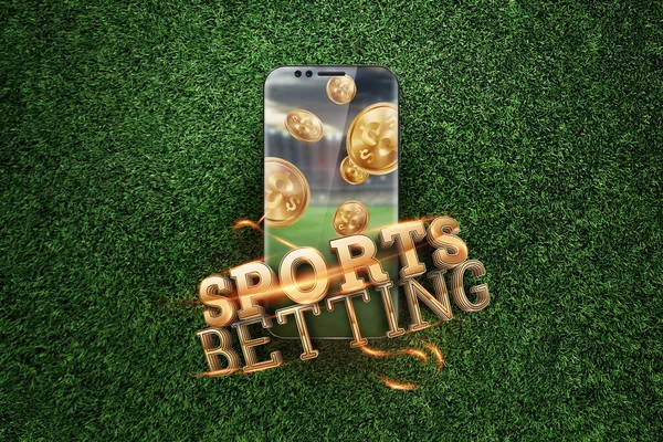 Gold inscription Sports Betting on a smartphone on a background of green grass. Bets, sports betting, bookmaker. Mixed media — Stock Photo, Image