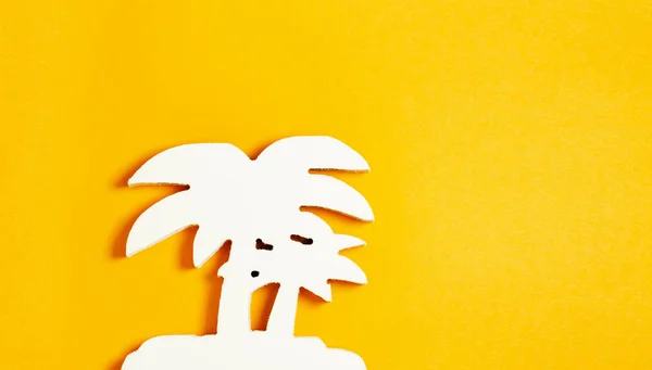 white Palm tree made of tree on pastel orange background. Flat lay. Summer tropical concept.