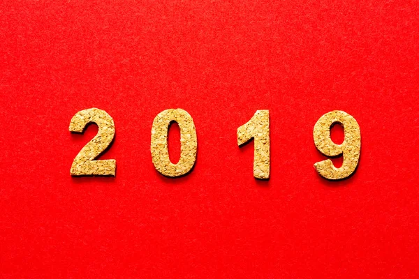 New years resolution 2019 concept. cork year number on red color background with copy space
