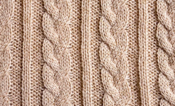 Rosa beige kabel stitch stickad ull bakgrund — Stockfoto