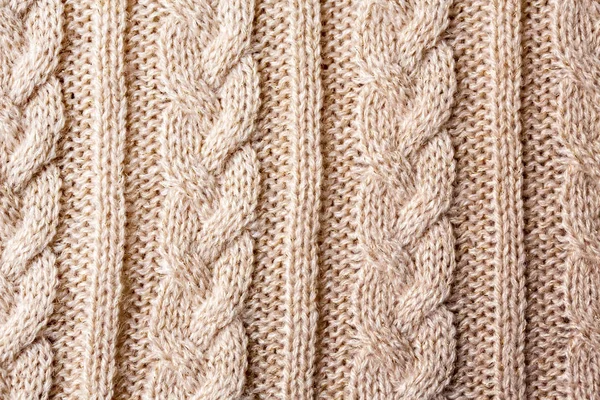 ピンク ベージュ ケーブル ステッチ ニット紡毛の背景 — ストック写真