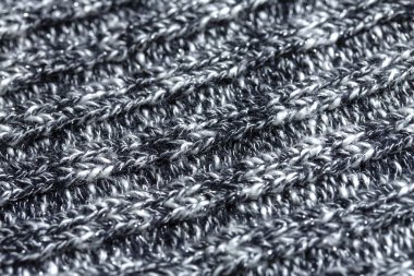 Pamuk veya yünden yapılmış siyah ve beyaz iplikler yün doku. Closeup.