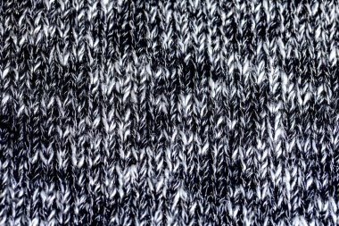 Pamuk veya yünden yapılmış siyah ve beyaz iplikler yün doku. Closeup.