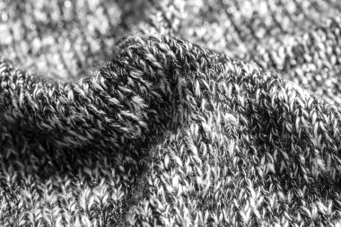 Pamuk veya yünden yapılmış siyah ve beyaz iplikler yün doku. Closeup.