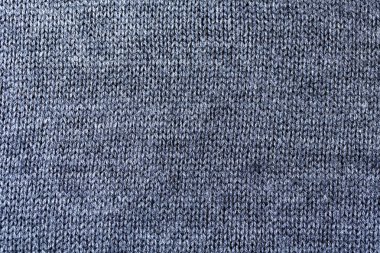 Pamuk veya yünden yapılmış gri desenli örme kumaşın arka plan dokusu.