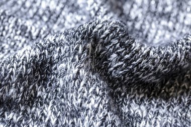 Pamuk veya yünden yapılmış siyah ve beyaz iplikler yün doku. Closeup.