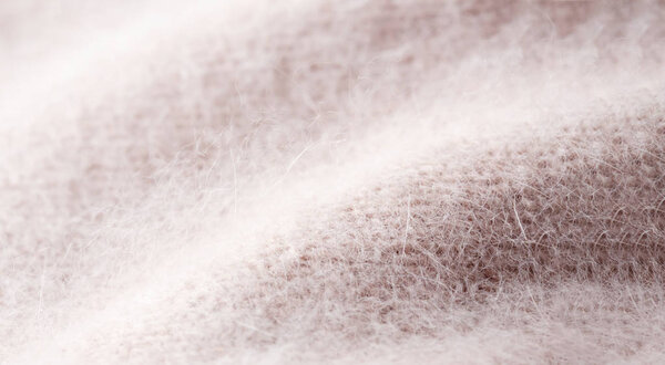 pink knitted angora and wool background.