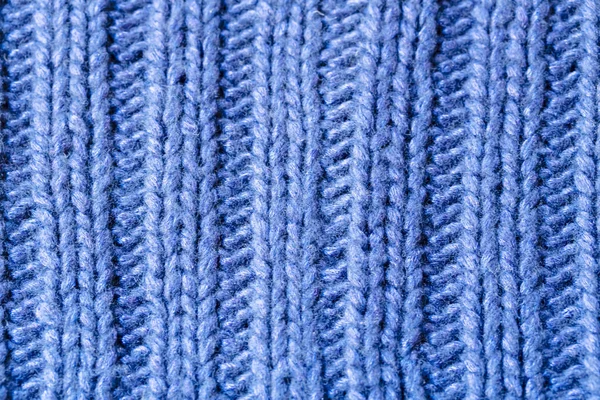 Голубое ребро или кабель стежка вязаный шерстяной фон — стоковое фото