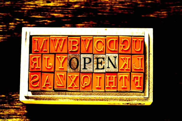 OPEN - isolated abstract in wood type stamps against wooden background and copy space. — Stock Photo, Image