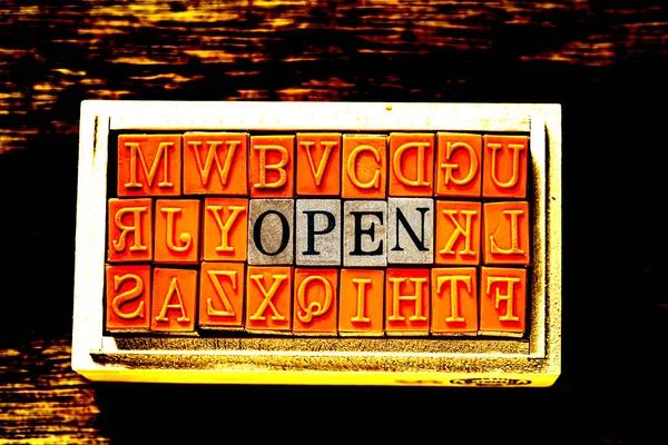 OPEN - isolated abstract in wood type stamps against wooden background and copy space. — Stock Photo, Image