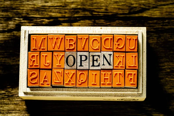 OPEN - isolated abstract in wood type stamps against wooden background and copy space. — Stock Photo, Image