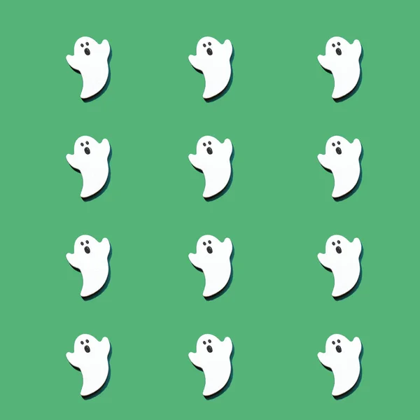 Zestaw białych duchów wyizolowanych na zielonym tle koloru. Halloween ornament jest kolorowy dźwięki. — Zdjęcie stockowe