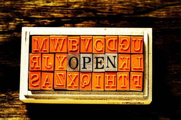 OPEN - isolated abstract in wood type stamps against wooden background and copy space. — Stock Photo, Image