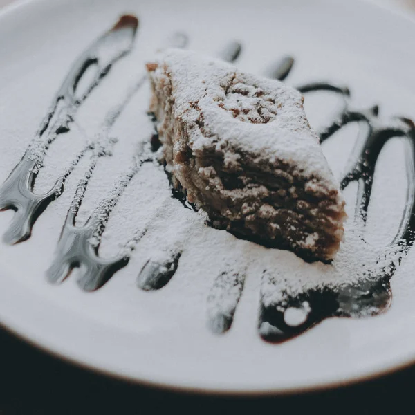 Arabic sweets dessert on ceramic plate.